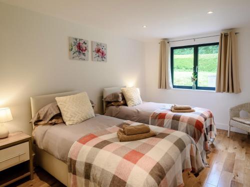 Ένα ή περισσότερα κρεβάτια σε δωμάτιο στο 2 Bed in Okehampton 75708