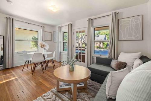 a living room with a couch and a table at Desert Modern Downtown Flagstaff Unit with Hot Tub in Flagstaff