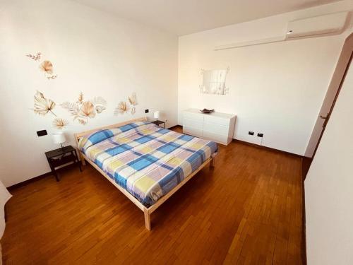 Katil atau katil-katil dalam bilik di Bilocale alle porte di Milano - Magnolia Apartment