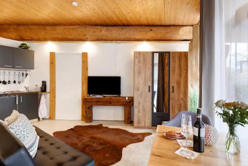 a living room with a couch and a table at Albchalet in Rosenfeld
