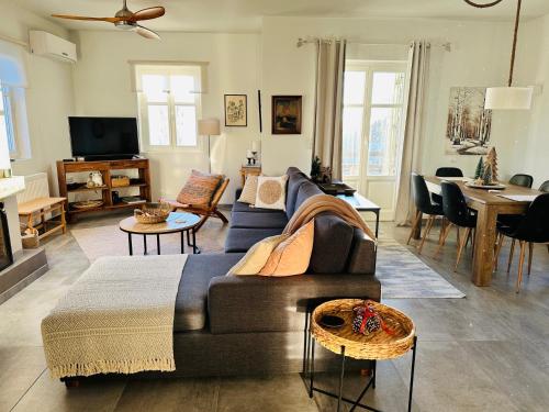 a living room with a couch and a table at Luxury Villa at Pelion- Ruby in Zagora