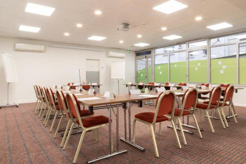 a conference room with a long table and chairs at Holiday Inn Express Amiens by IHG in Amiens