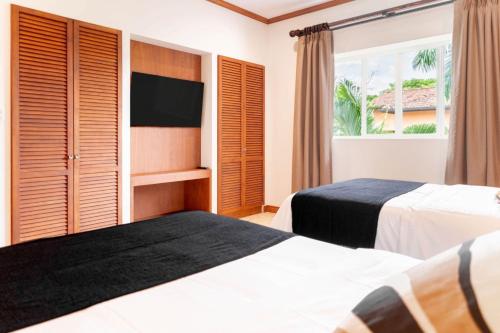 Ένα ή περισσότερα κρεβάτια σε δωμάτιο στο Stylish Apartment w/ Hotel Amenities @ Los Sueños