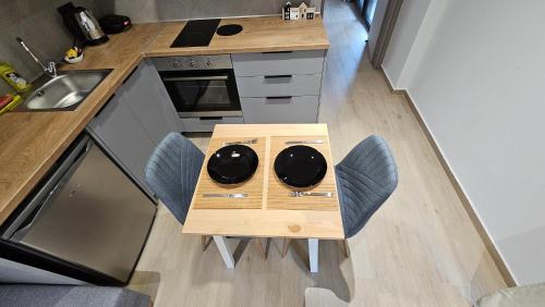 an overhead view of a kitchen with a table and chairs at Sezame in Ioannina