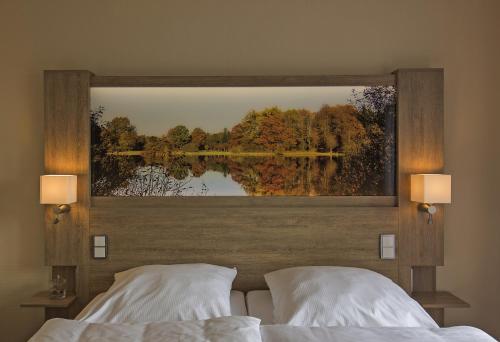 Ένα ή περισσότερα κρεβάτια σε δωμάτιο στο Hotel Wittensee Schützenhof
