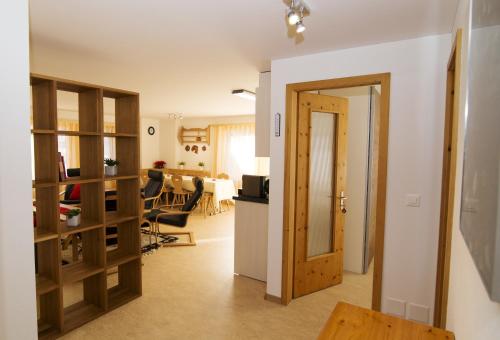 a room with a kitchen and a dining room at Alte Sägerei in Glaris