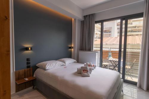 Ένα ή περισσότερα κρεβάτια σε δωμάτιο στο Δ17 Suites & Apartments