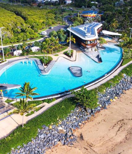 an aerial view of a swimming pool at a resort at Beach House Yeppoon - ARay at Cooee Bay - Apt A in Yeppoon