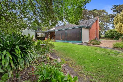 a house with a green yard in front of it at Spottiswoode - 215 Barclay Road, Myponga in Myponga