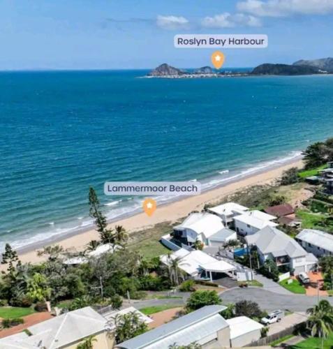 an aerial view of the beach and the ocean at Beach House Yeppoon - ARay at Cooee Bay - Apt A in Yeppoon