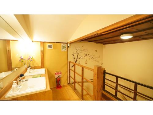 a bathroom with a sink and a mirror and a sink at Uji Tea Inn - Vacation STAY 27219v in Uji