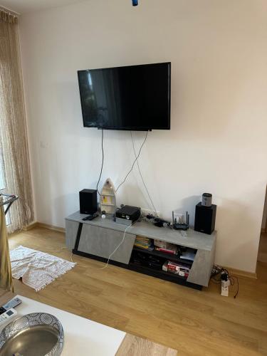 a living room with a flat screen tv on the wall at Alex Beach in Elenite