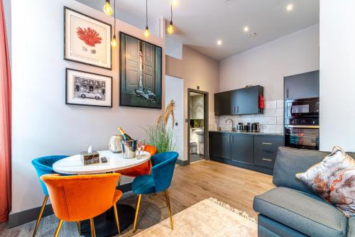 a living room with a table and a couch at Duke Street Townhouse in Liverpool