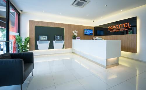 a lobby of a sooty supermarket with a reception desk at Sovotel Uptown 101 in Petaling Jaya