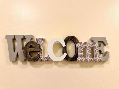 a sign that says new on a wall at Renovated Apartment in Antwerp city center in Antwerp