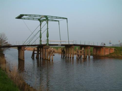 a bridge over a body of water at Bij De Kunstenaars in Ulrum