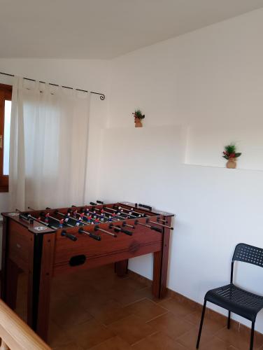 a room with a table with a bunch of weapons at Cal Massana in Sant Guim de la Plana