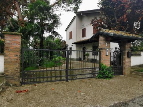 a black wrought iron gate in front of a house at LA CASA DI GIM in Lugo