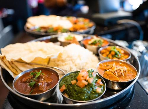 a tray of different types of food on a table at Days Inn by Wyndham Cranbrook Conference Centre in Cranbrook