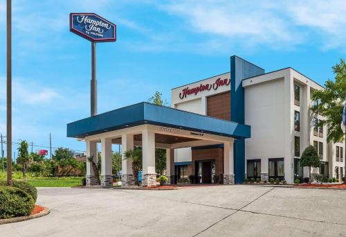 a sign in front of a shopping center at Hampton Inn Columbia-I-26 Airport in Columbia