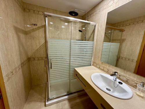 a bathroom with a sink and a shower at APARTMENT WITH OCEAN VIEW in Playa del Cura