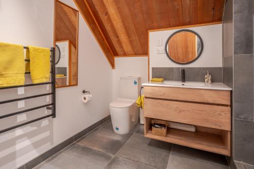 a bathroom with a sink and a toilet at French Peak Loft - French Farm Holiday Home in Taihape