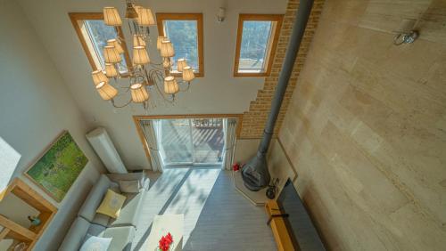 an overhead view of a staircase in a house with a chandelier at Amuse 545 in Yangpyeong