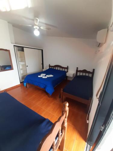 a bedroom with two beds in a room at 4 Ases Hotel in Embalse