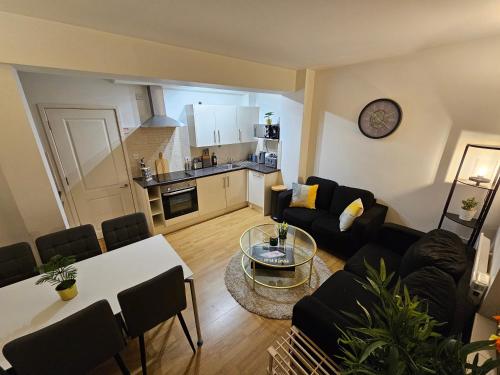 a living room with a couch and a table at 2bdr Islington close to station in London