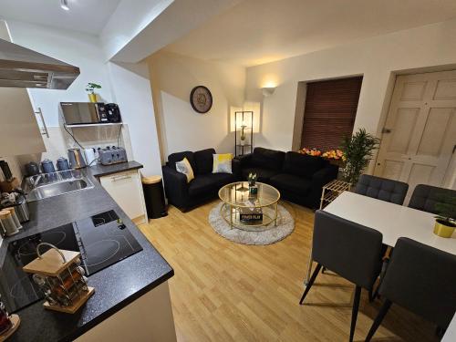 a living room with a couch and a table at 2bdr Islington close to station in London
