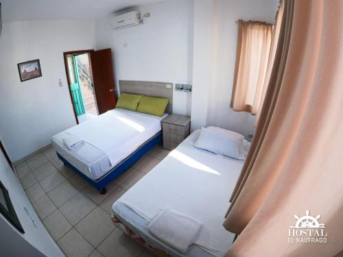 Hostal El Naufrago 1にあるベッド