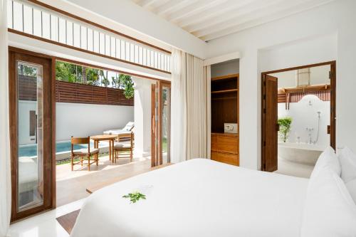 Postel nebo postele na pokoji v ubytování SALA Samui Choengmon Beach Resort
