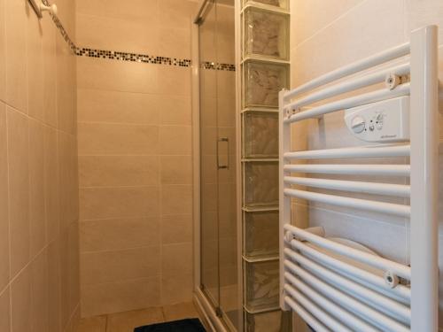 a shower with a glass door in a bathroom at Gîte Montreuil-le-Henri, 2 pièces, 2 personnes - FR-1-410-225 in Montreuil-le-Henri