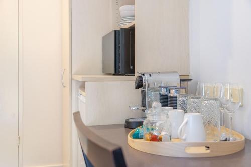 a kitchen counter with a coffee maker on it at Elizabeth Motor Inn in Newcastle