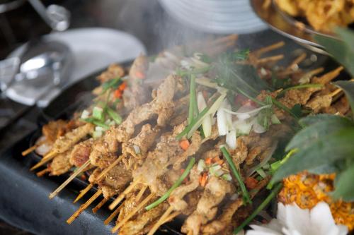 a pile of food on a black plate at Mila Cruises in Ha Long