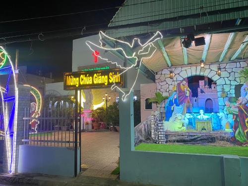 a entrance to a disney store with a sign at Villa sân vườn Misa in Phan Thiet