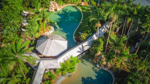 an aerial view of a pool in the middle of a river at Cairns Colonial Club Resort in Cairns