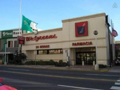a store on the corner of a street at Esperanza Beach 2BDR 2B Oceanfront Pool Parking in San Juan
