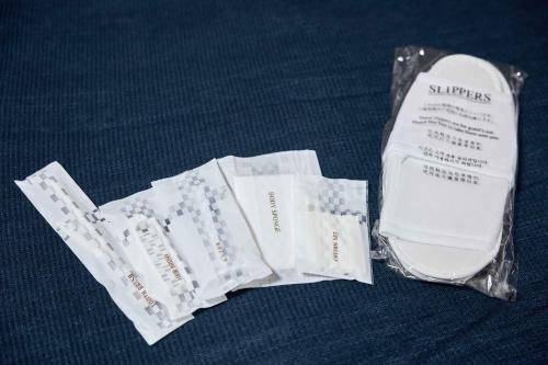 a group of white packets in a plastic bag at ESLEAD HOTEL Osaka Tsuruhashi in Osaka