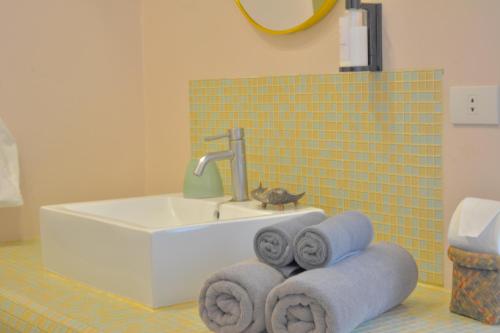 Ein Badezimmer in der Unterkunft Le Divine Comedie Beach Resort