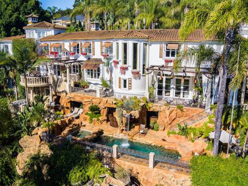 an aerial view of a house with a waterfall at Luxury Bel Air Villa Heated Pool Panoramic Views 6 Bedrooms in Los Angeles