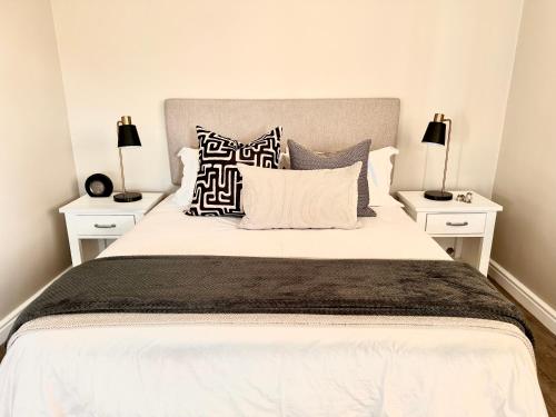 Ένα ή περισσότερα κρεβάτια σε δωμάτιο στο Mountain Pearl Cottage