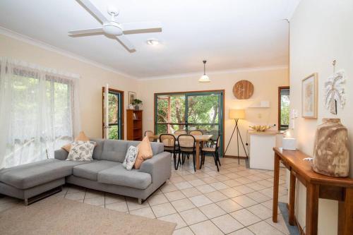 a living room with a couch and a table at Tuckeroo + sleeps 10 + central in Point Lookout