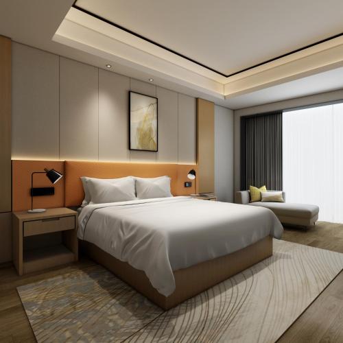 a bedroom with a large white bed and a couch at Hilton Garden Inn Wuhan Hankou in Wuhan