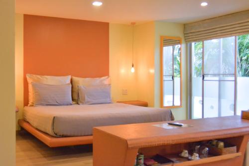 Ein Bett oder Betten in einem Zimmer der Unterkunft Le Divine Comedie Beach Resort