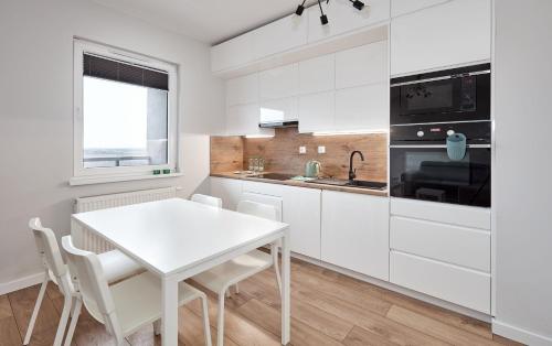 10th Floor Unii Lubelskiej Apartment tesisinde mutfak veya mini mutfak