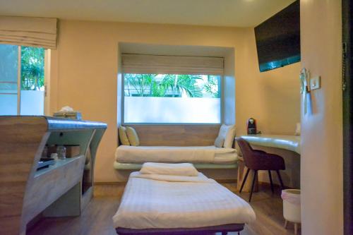 TV/Unterhaltungsangebot in der Unterkunft Le Divine Comedie Beach Resort