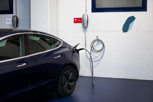a electric car is plugged into a garage at Garda Hotel in Montichiari