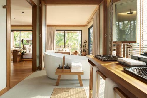 a bathroom with a large tub in a room at The Retreat Koh Chang, an SLH Hotel in Ko Chang