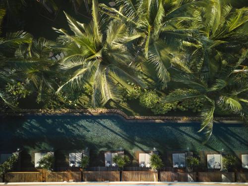 an overhead view of a building with palm trees at The Retreat Koh Chang, an SLH Hotel in Ko Chang